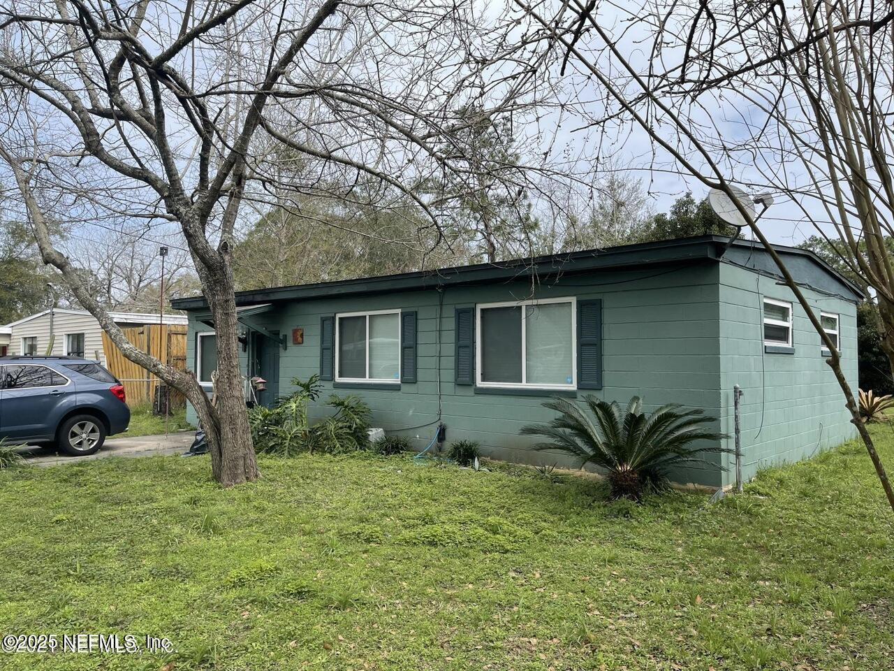 a house view with a garden space