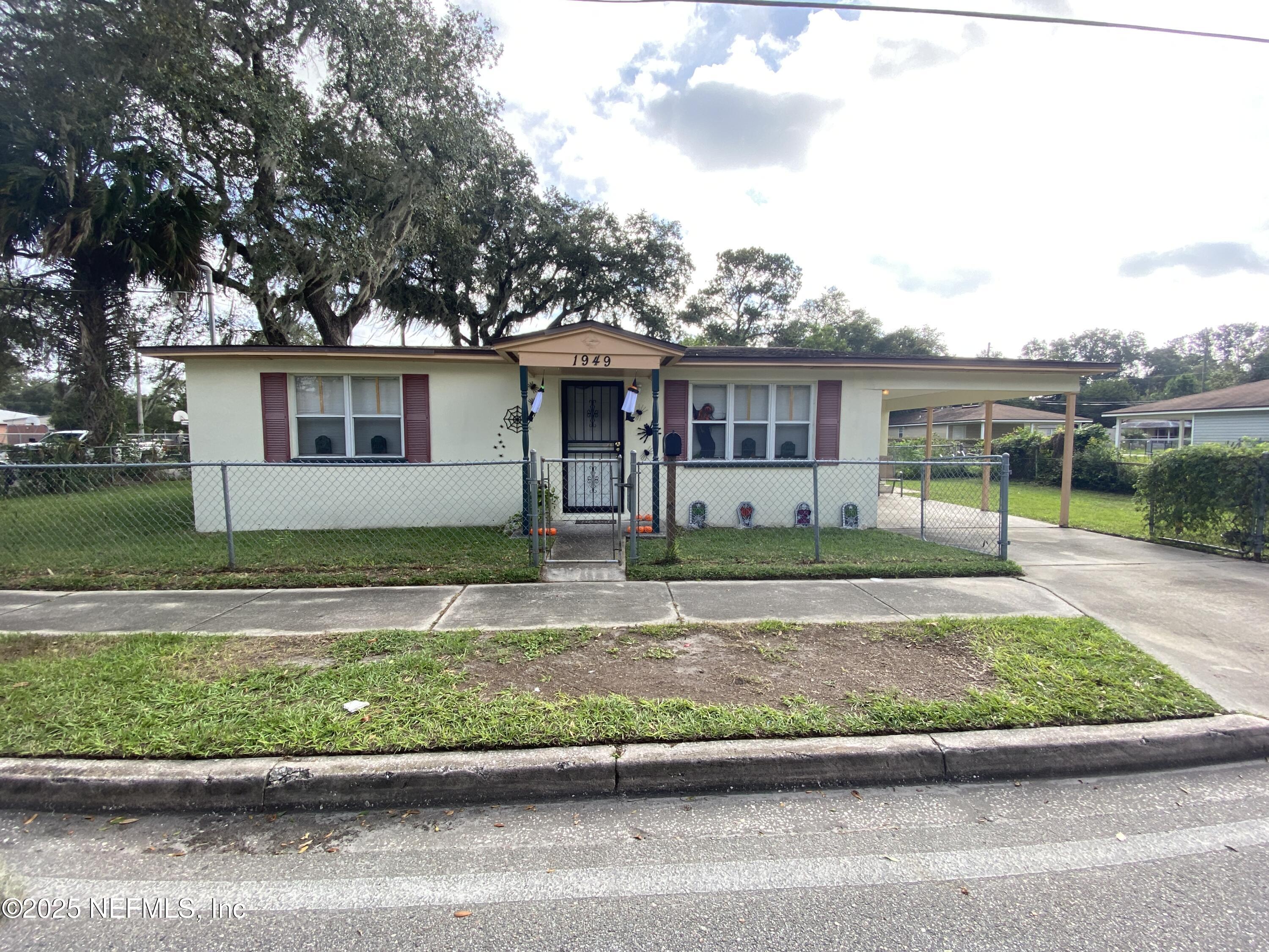 10321 Westmar Road Jacksonville, FL 32218 - Photo 6 of 7 front view of house with a yard