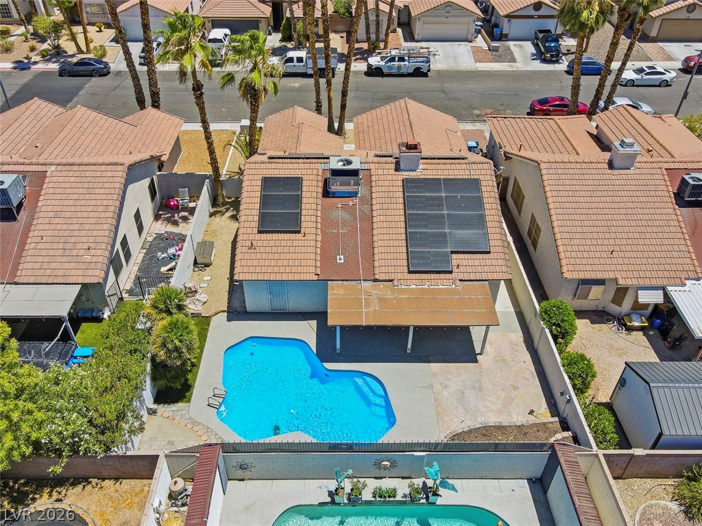2609 Shakespeare Road Las Vegas, NV 89108 - Photo 41 of 41 An aerial perspective reveals a private swimming pool, patio area, and roof-mounted solar panels.