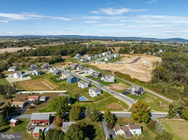 an aerial view of residential building and ocean
