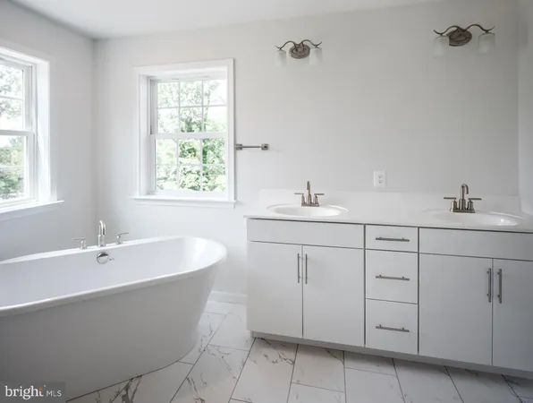 a bathroom with a bathtub and sink
