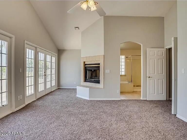 16625 South 34th Way Phoenix, AZ 85048 - Photo 11 of 36 a view of an empty room with a fireplace and a window
