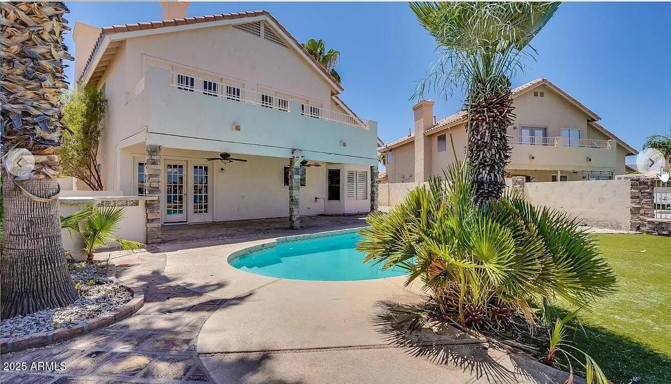 16625 South 34th Way Phoenix, AZ 85048 - Photo 2 of 36 a front view of a house with garden