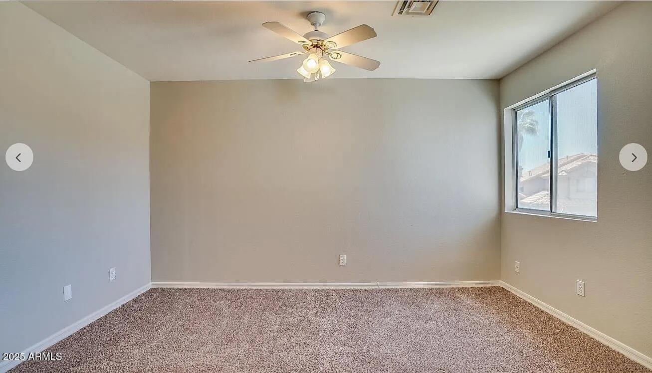 16625 South 34th Way Phoenix, AZ 85048 - Photo 22 of 36 an empty room with windows and fan