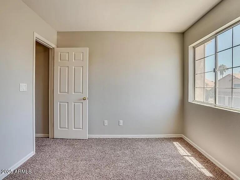 16625 South 34th Way Phoenix, AZ 85048 - Photo 23 of 36 an empty room with windows