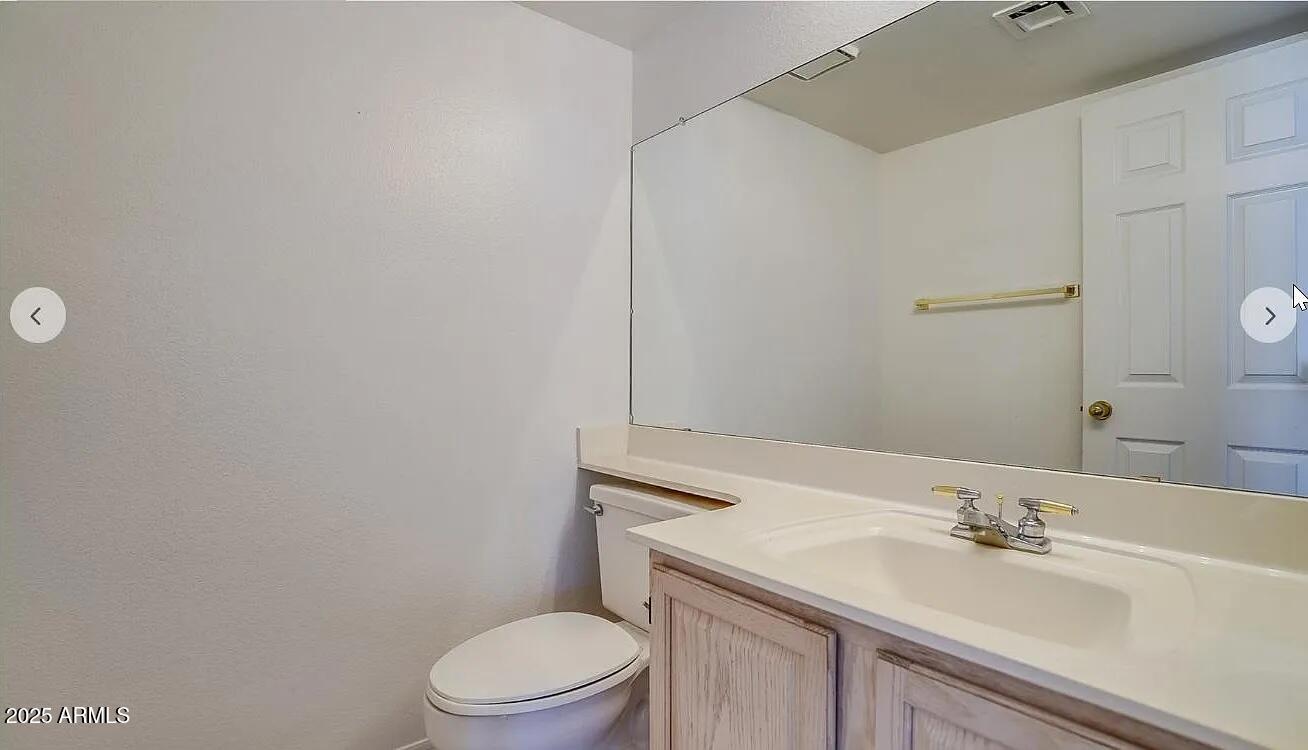 16625 South 34th Way Phoenix, AZ 85048 - Photo 24 of 36 a bathroom with a sink a toilet and mirror