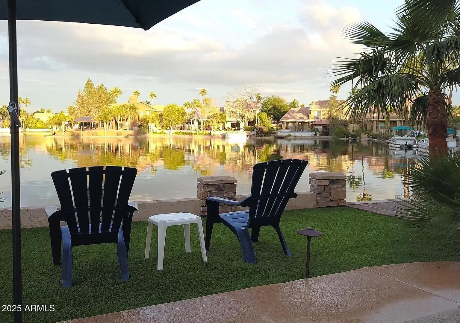 16625 South 34th Way Phoenix, AZ 85048 - Photo 31 of 36 a view of a lake with table and chairs