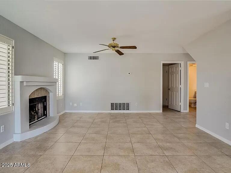 16625 South 34th Way Phoenix, AZ 85048 - Photo 8 of 36 wooden floor fireplace and windows in a room