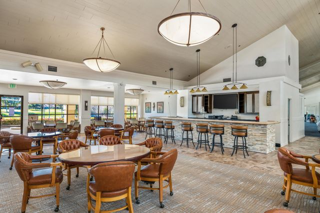 a very nice looking dining room with a table and chairs