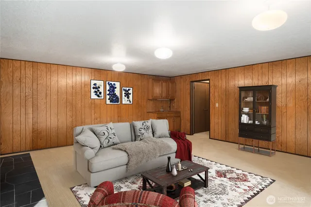 a living room with furniture and a rug