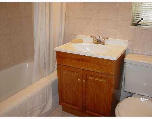3308 Southeast 3rd Street Pompano Beach, FL 33062 - Photo 17 of 24 a bathroom with a sink and a mirror