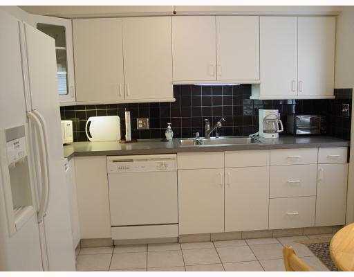3308 Southeast 3rd Street Pompano Beach, FL 33062 - Photo 10 of 24 a kitchen with a sink and cabinets