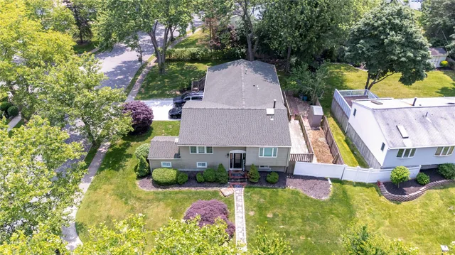 a aerial view of a house with swimming pool and garden