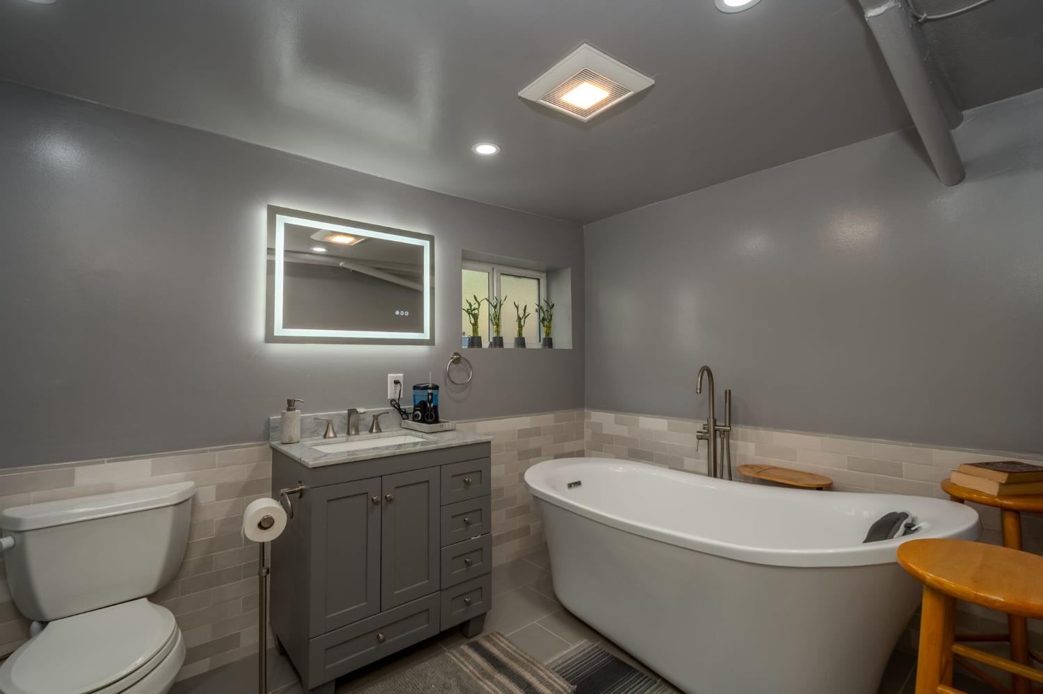 15663 Ojai Road Santa Paula, CA 93060 - Photo 22 of 47 a bathroom with a toilet sink and mirror