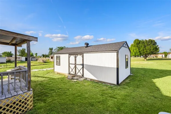 a view of a porch with a backyard