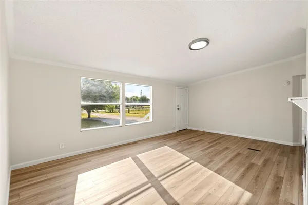 a view of an empty room and window