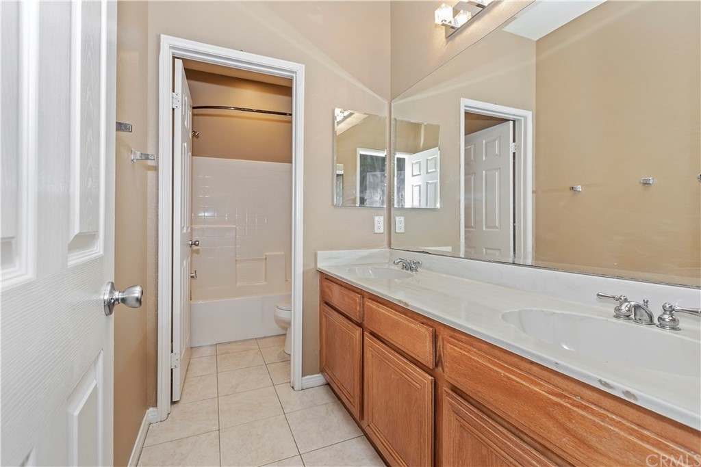 12358 High Horse Drive Rancho Cucamonga, CA 91739 - Photo 18 of 25 Hall bath has double sinks and separate tub. Great for kids getting ready for school.