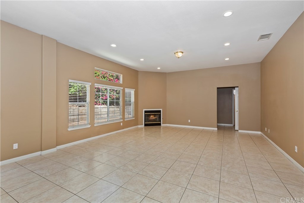 12358 High Horse Drive Rancho Cucamonga, CA 91739 - Photo 6 of 25 Oversize Family Room with cozy fireplace is ideal gathering place to watch the Big game or just chill with the family.