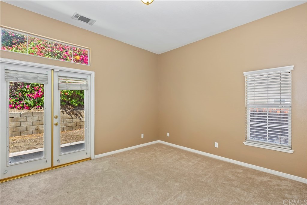 12358 High Horse Drive Rancho Cucamonga, CA 91739 - Photo 10 of 25 Downstairs BR has French door s to rear yard for a bright and airy atmosphere.