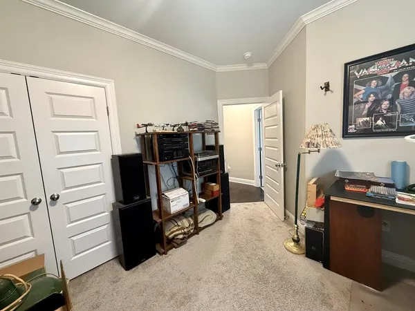 a view of a storage & utility room with refrigerator and washer
