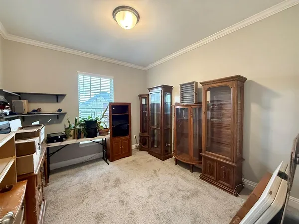a view of a livingroom with furniture and an empty space