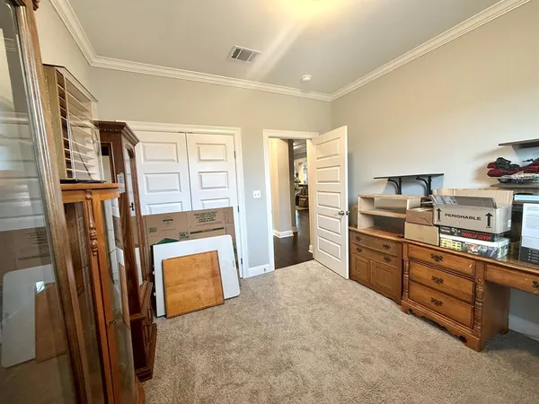 a kitchen with stainless steel appliances granite countertop a refrigerator and a stove