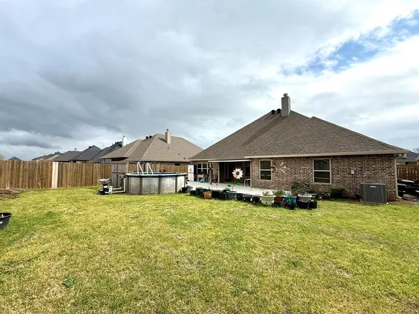 a big house with the garden in front of it