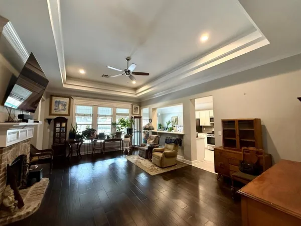 a living room with furniture window and a flat screen tv