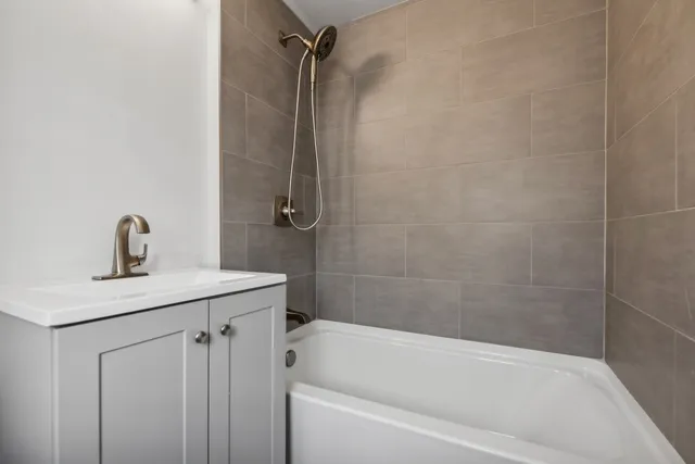 a bath room with a sink toilet and shower