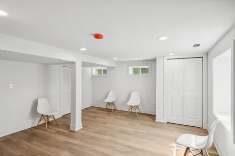 a view of a room with wooden floor and chair