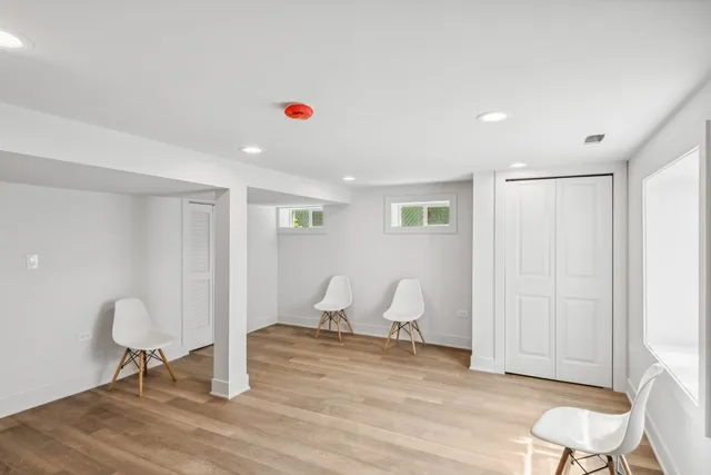 a view of a room with wooden floor and chair