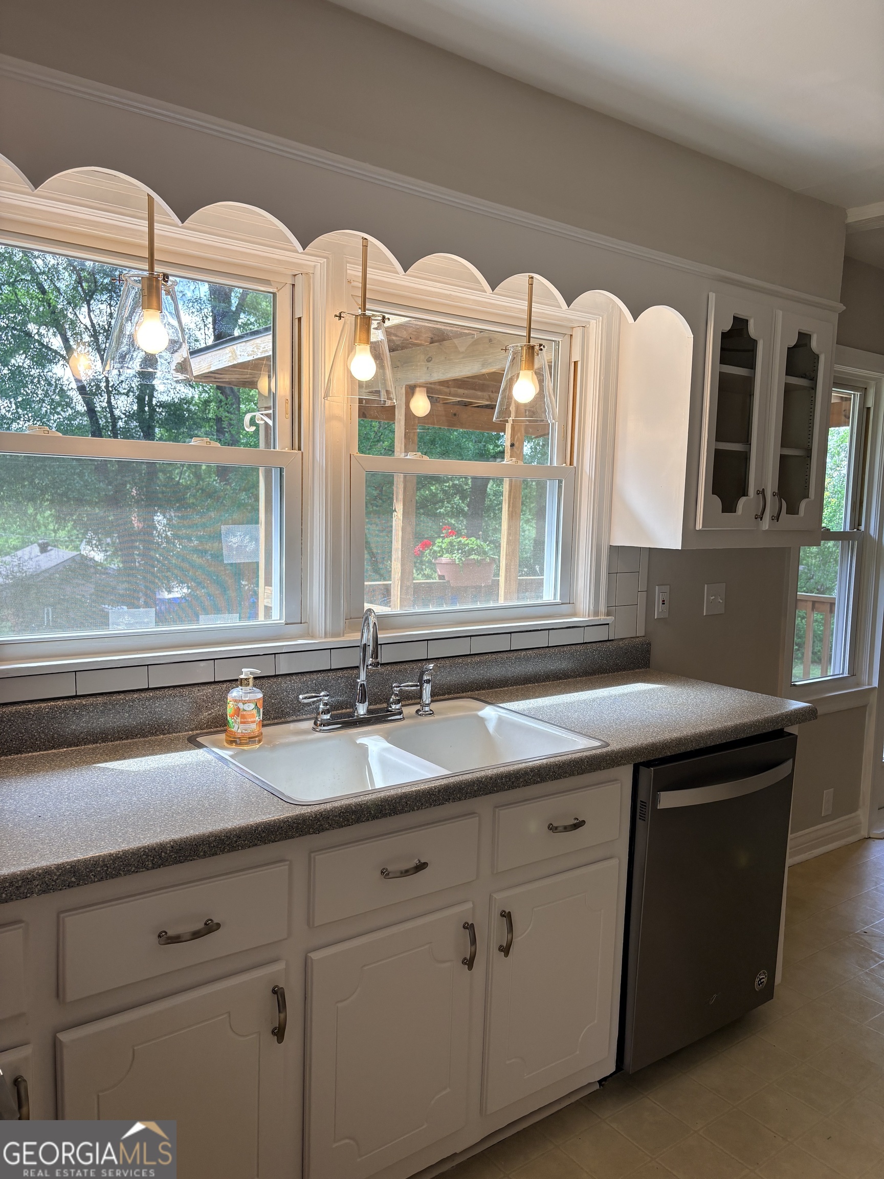 218 Flora Avenue Southeast Rome, GA 30161 - Photo 13 of 24 a kitchen with a sink and large window