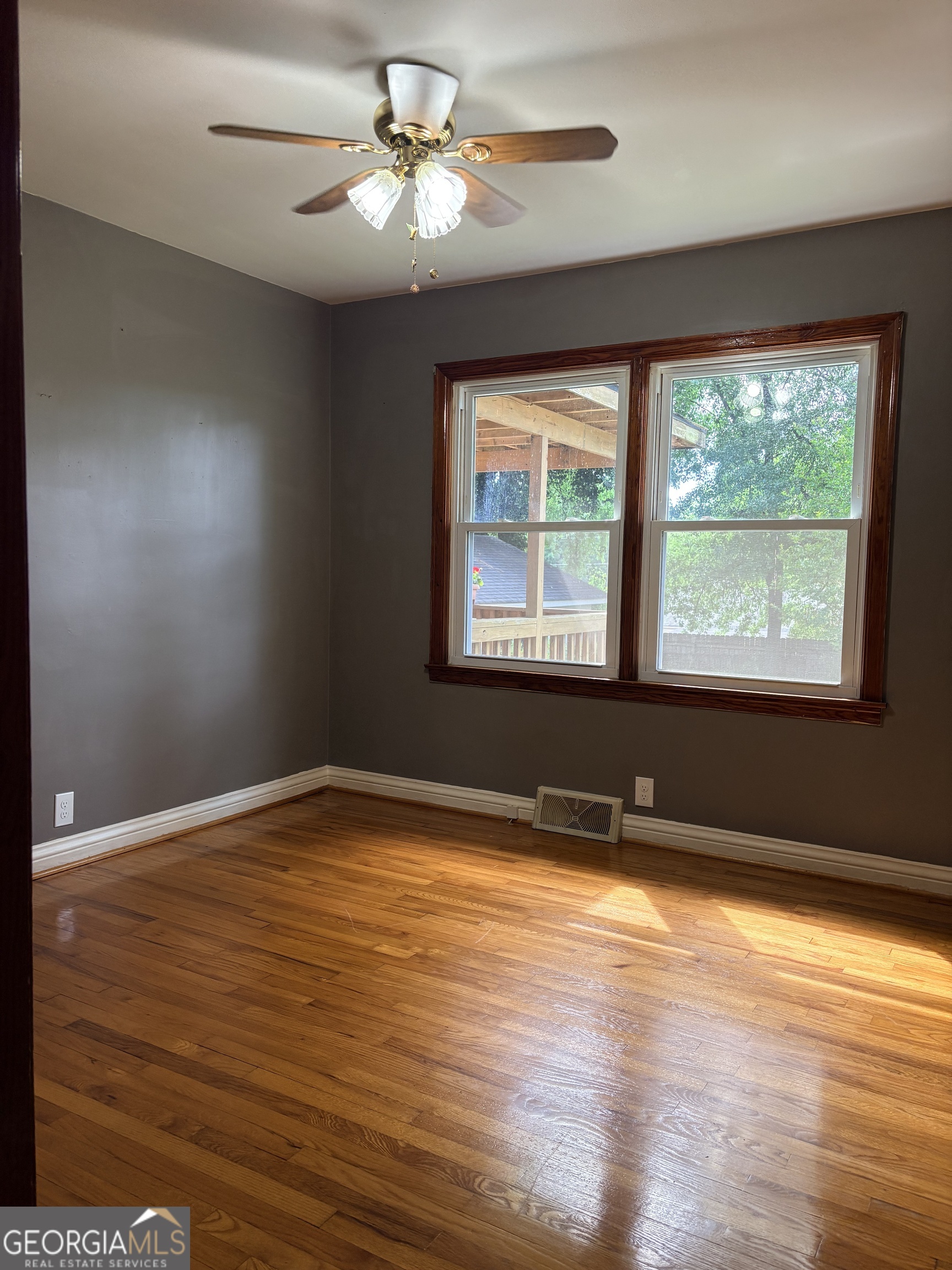 218 Flora Avenue Southeast Rome, GA 30161 - Photo 15 of 24 a view of an empty room with a window and wooden floor