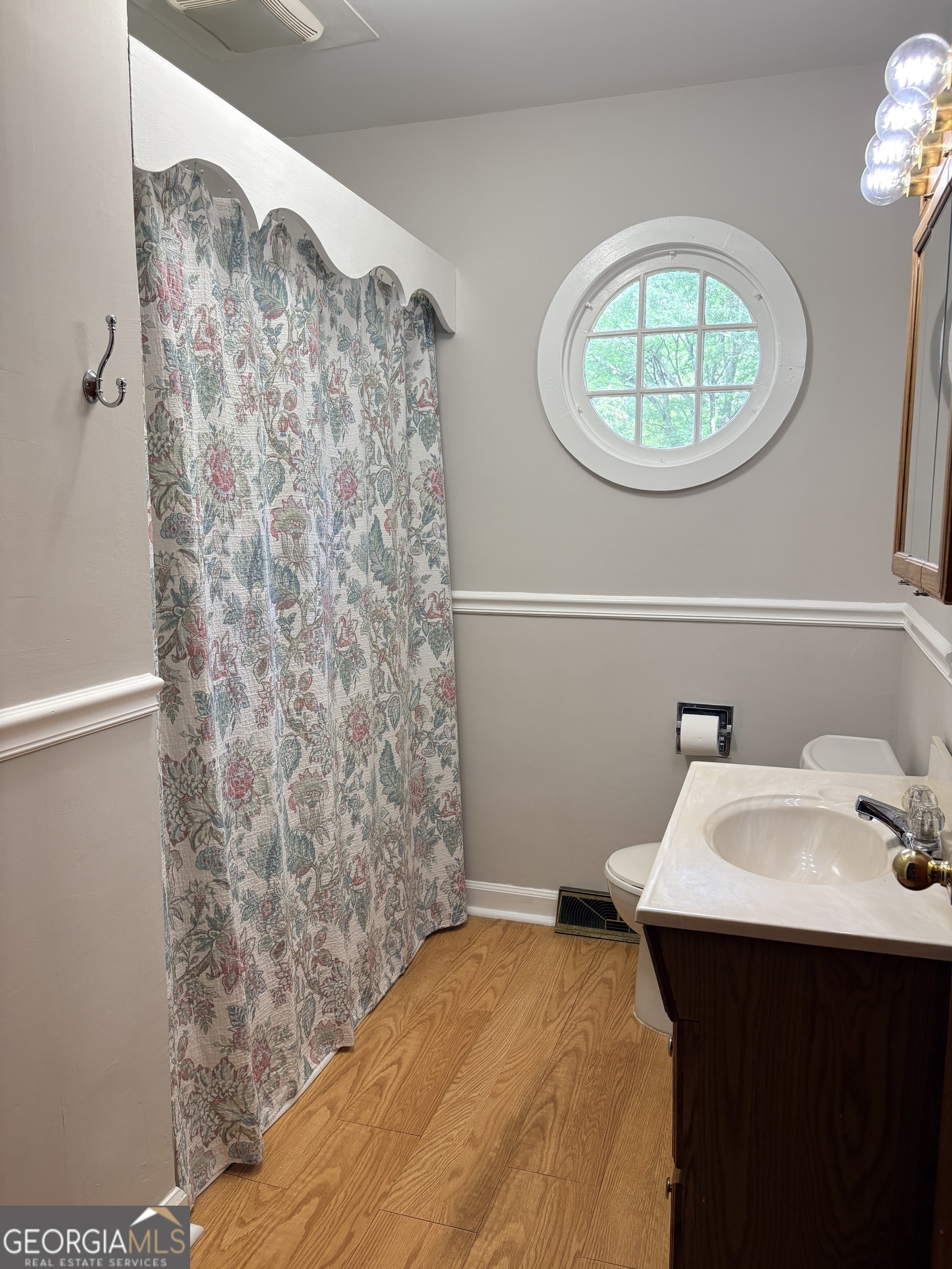 218 Flora Avenue Southeast Rome, GA 30161 - Photo 20 of 24 a bathroom with a sink and a mirror