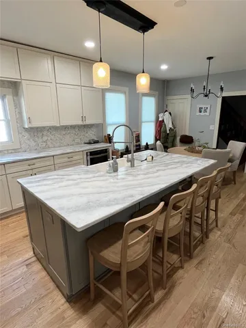 a kitchen with cabinets appliances and a counter space