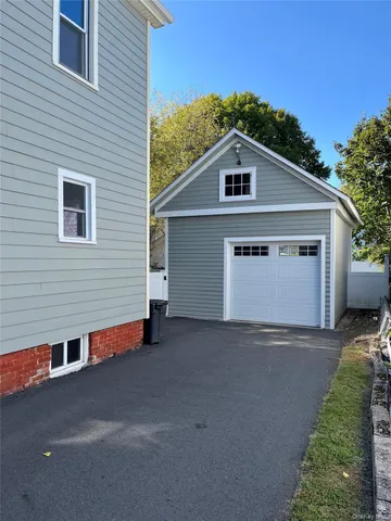 a living room with lots of furniture and kitchen view
