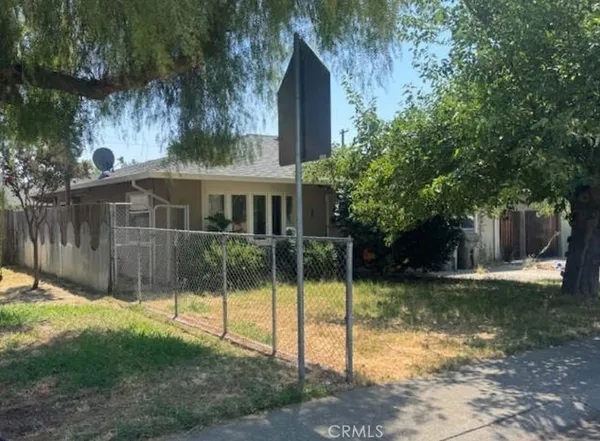 a view of a house with backyard from a house