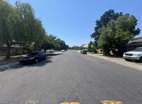 a view of street with parked cars
