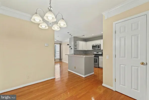 a kitchen with a refrigerator and cabinets