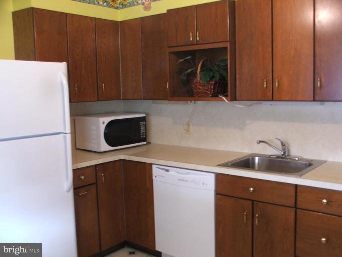 1101 Oakland Terrace Road Halethorpe, MD 21227 - Photo 21 of 21 Refrigerator, sink, Dishwasher & Microwave