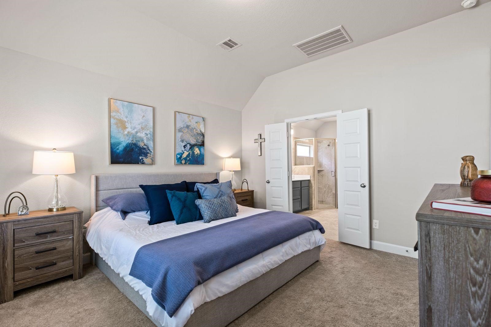 321 Rise Lane Montgomery, TX 77316 - Photo 4 of 9 a bedroom with a bed and painting on the wall