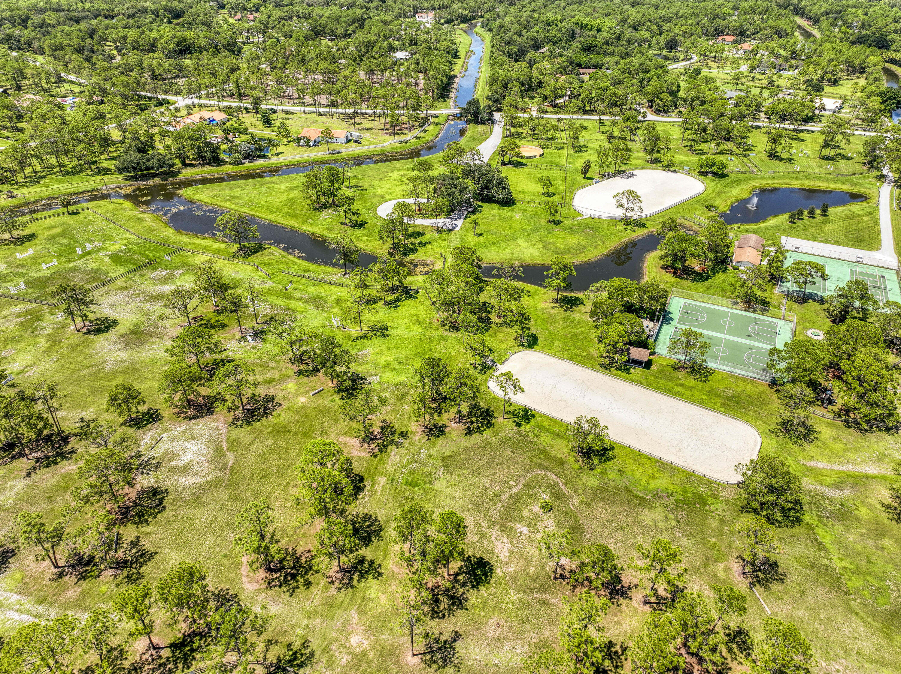 13395 Running Water Road Palm Beach Gardens, FL 33418 - Photo 107 of 112 a view of a yard with swimming pool