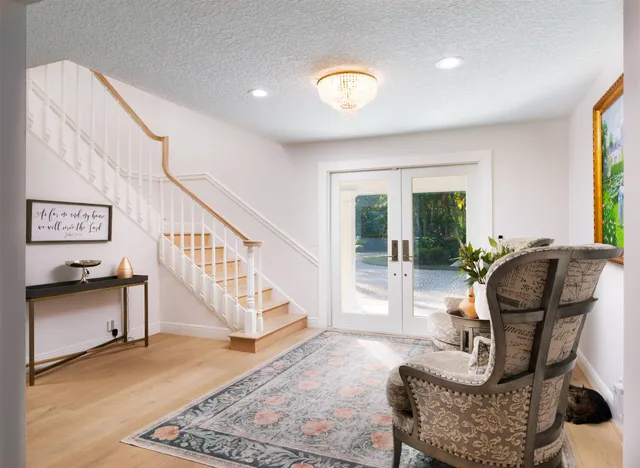 a view of a kitchen with a sink washer and dryer