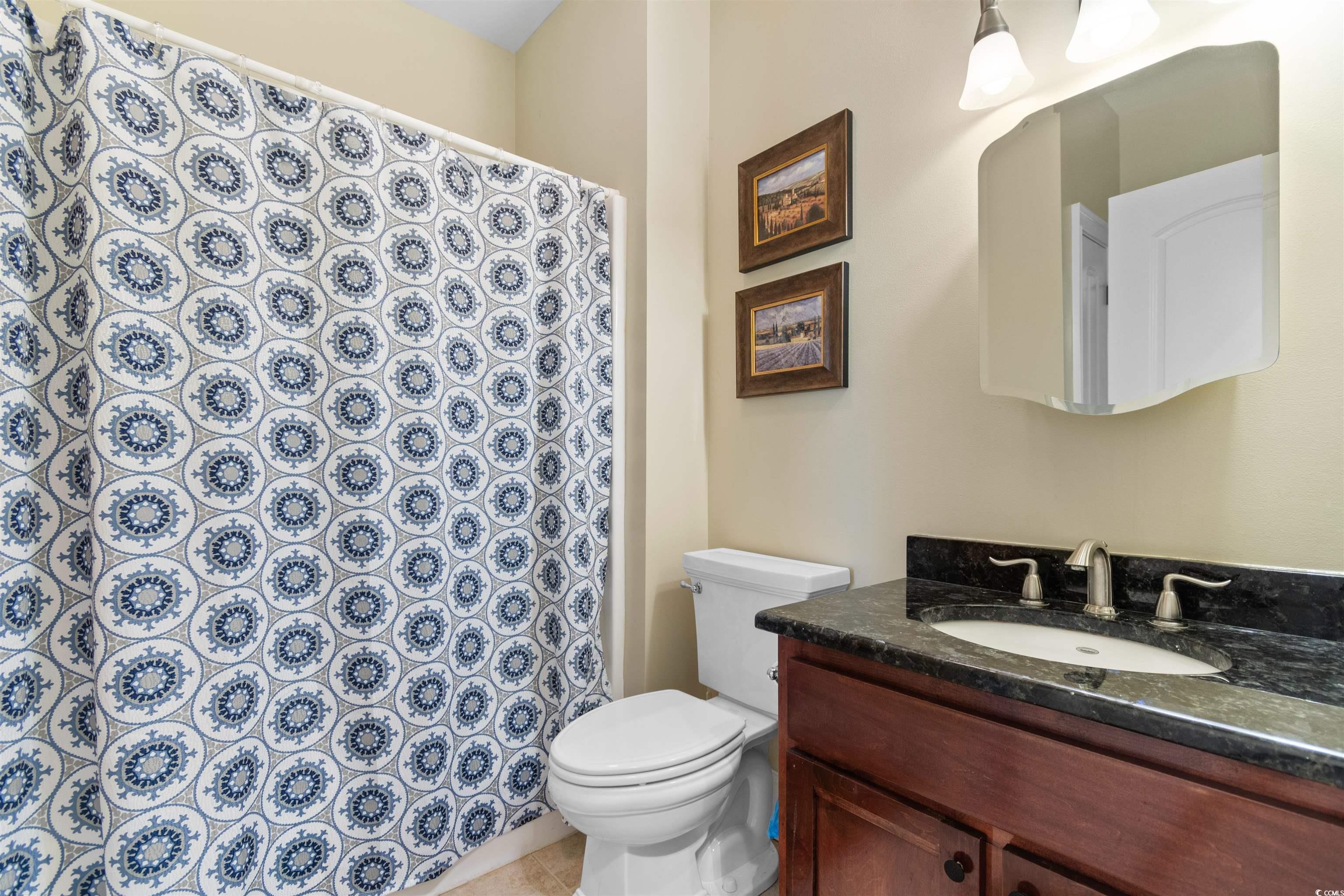 1815 Gilbert Road Conway, SC 29527 - Photo 29 of 40 Bathroom with vanity, toilet, and tile patterned f