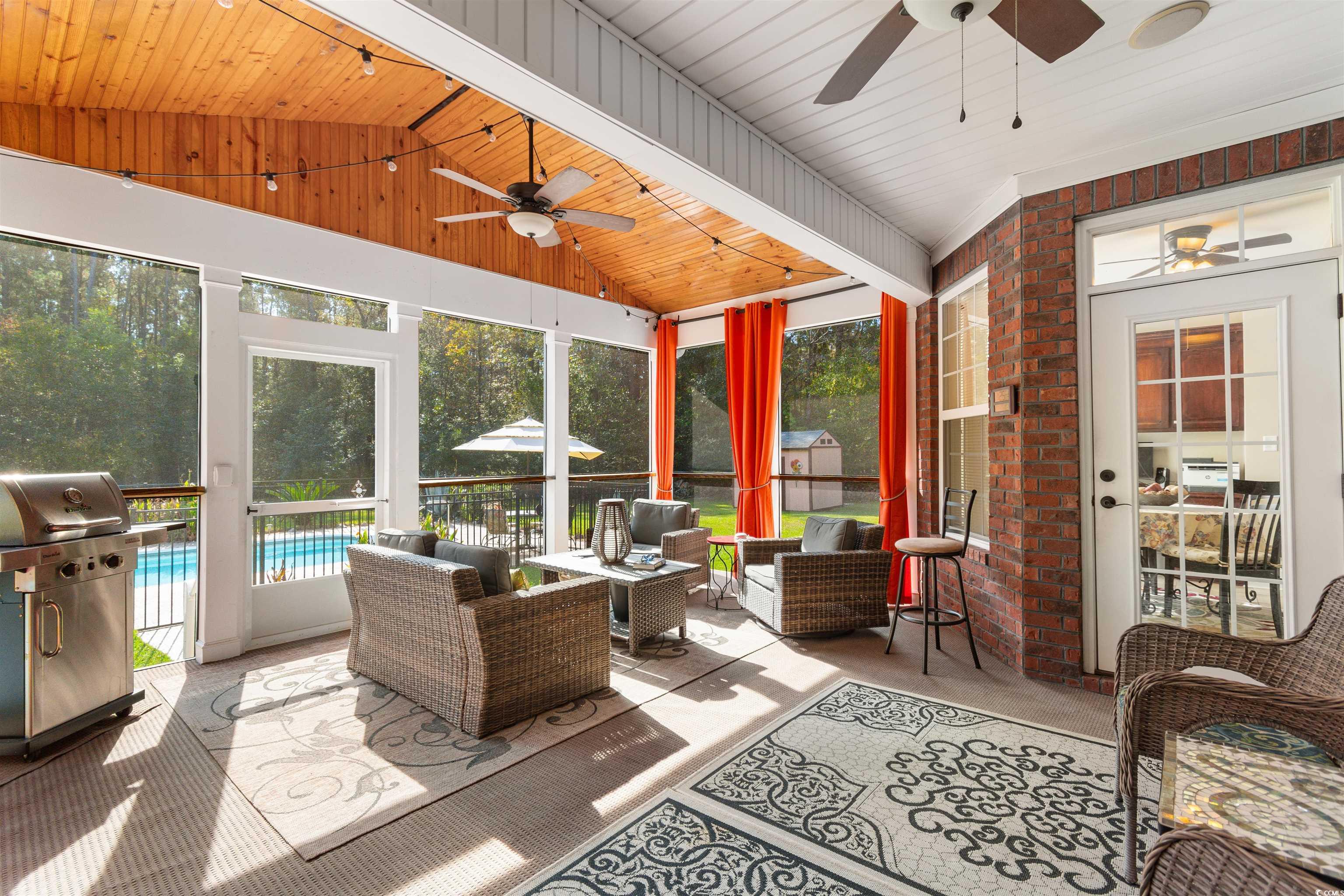 1815 Gilbert Road Conway, SC 29527 - Photo 33 of 40 Sunroom featuring vaulted ceiling with beams, a sw