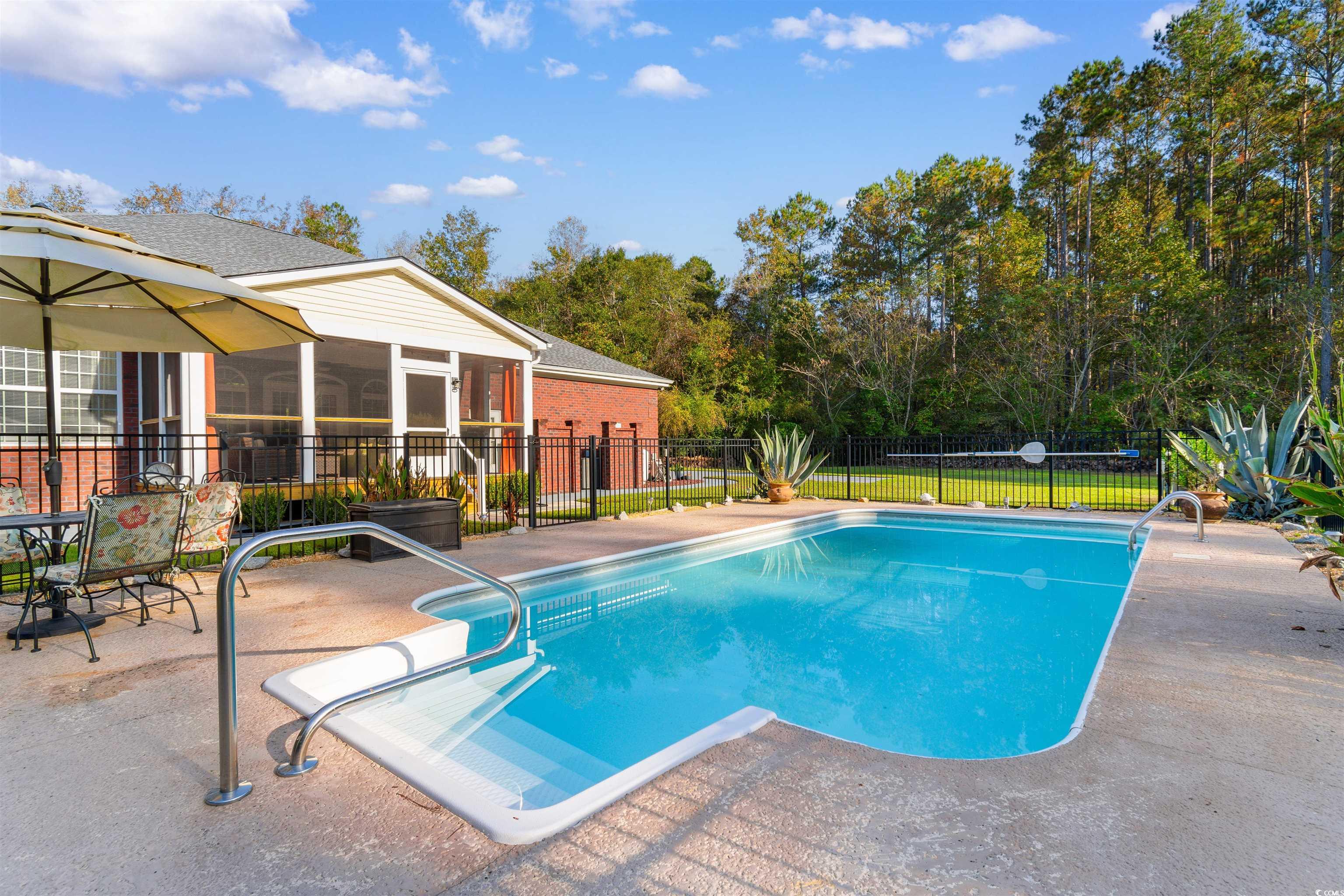1815 Gilbert Road Conway, SC 29527 - Photo 34 of 40 View of pool with a sunroom and a patio area