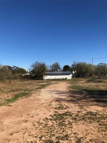 a view of lake with green space