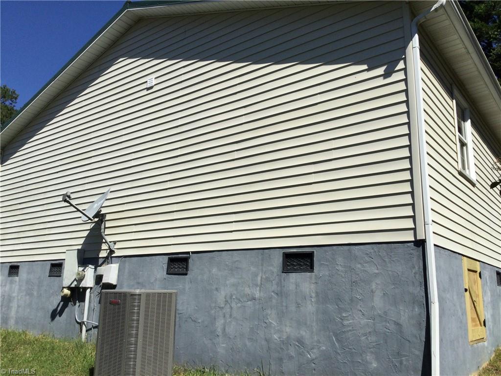1017 Sales Street High Point, NC 27260 - Photo 14 of 40 Left Rear View: Here we can see the low maintenance vinyl siding and the outside HVAC unit.