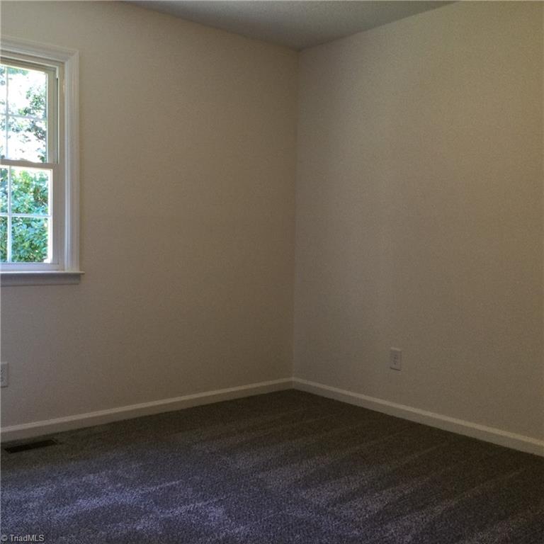 1017 Sales Street High Point, NC 27260 - Photo 26 of 40 Bedroom 2: Fearures include carpet flooring to help keep you warm on cool mornings, fresh new paint and a window for natural lighting.