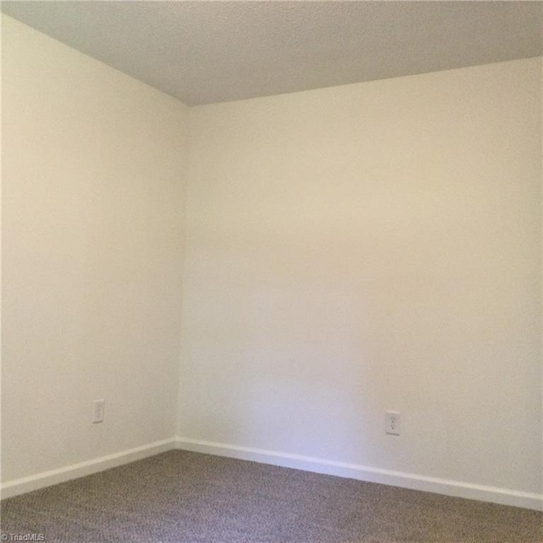 1017 Sales Street High Point, NC 27260 - Photo 27 of 40 Bedroom 2: Fearures include carpet flooring to help keep you warm on cool mornings, fresh new paint and a window for natural lighting.